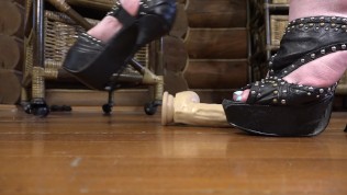 Thin heels trample rubber dick with eggs. Crush fetish and ballbusting
